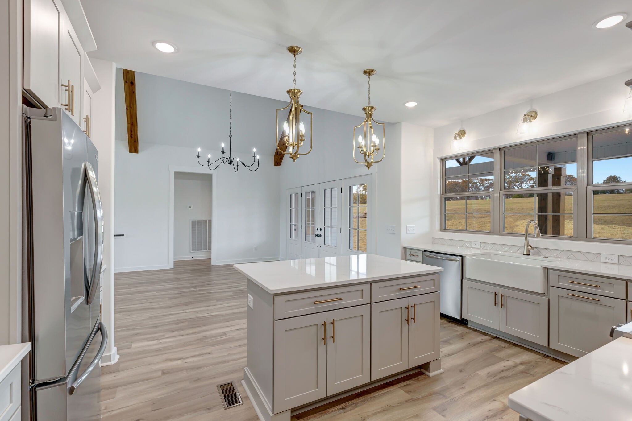 1 Hunter Bills Road Lewisburg, TN 37091 - Photo 18 of 48 a large kitchen with stainless steel appliances kitchen island granite countertop a sink refrigerator and cabinets