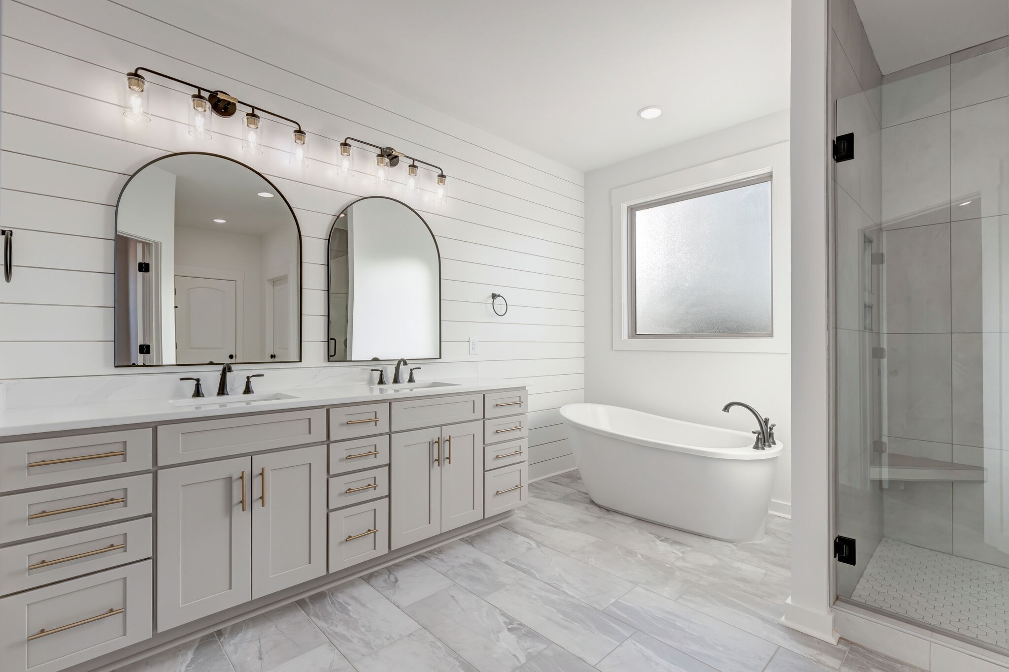 1 Hunter Bills Road Lewisburg, TN 37091 - Photo 28 of 48 a spacious bathroom with a double vanity sink a mirror and a bathtub