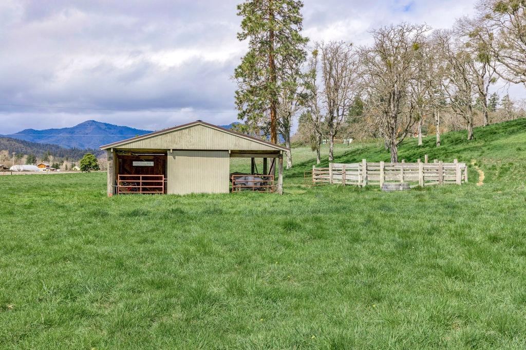 2076 Upper Applegate Road Jacksonville, OR 97530 - Photo 7 of 35 a view of a house with a yard and sitting area
