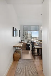 a view of a dining room with furniture and window
