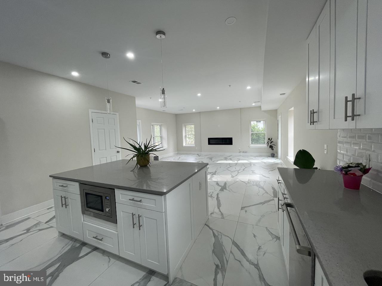8618 Jones Mill Road Chevy Chase, MD 20815 - Photo 16 of 59 a kitchen with white cabinets and sink