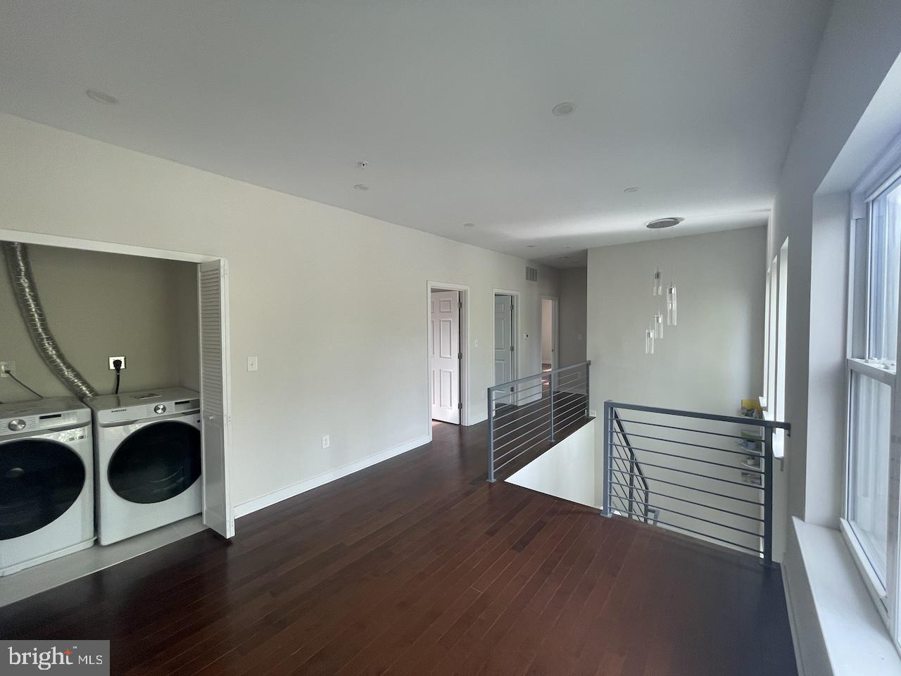 8618 Jones Mill Road Chevy Chase, MD 20815 - Photo 29 of 59 a view of a hallway with wooden floor and cabinets