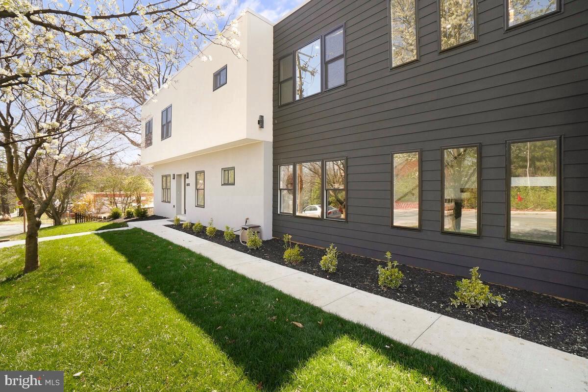 8618 Jones Mill Road Chevy Chase, MD 20815 - Photo 3 of 59 a front view of a house with garden