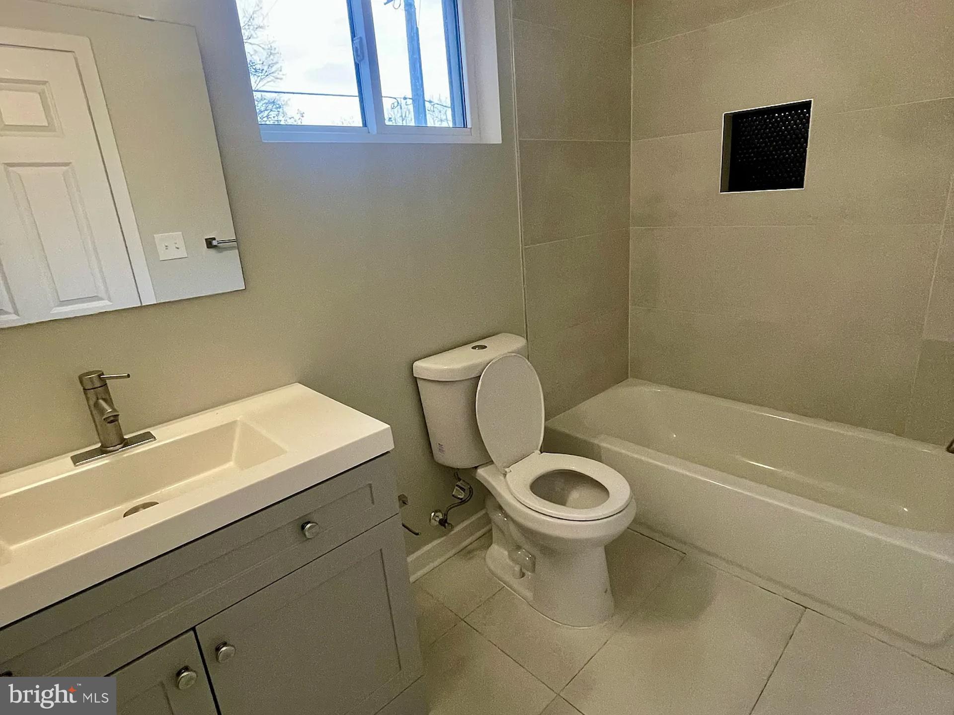 8618 Jones Mill Road Chevy Chase, MD 20815 - Photo 32 of 59 a bathroom with a sink a toilet and bathtub