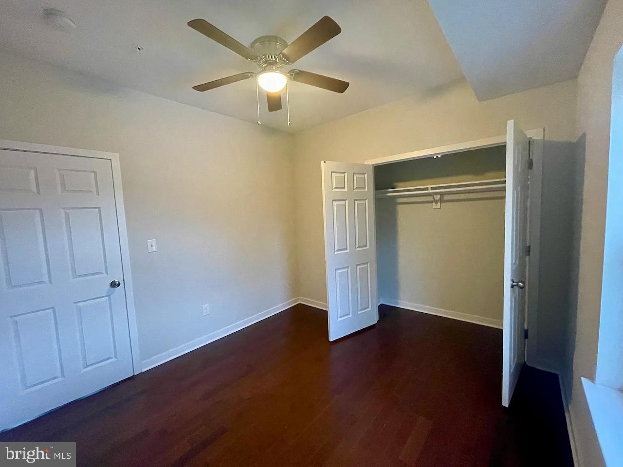 8618 Jones Mill Road Chevy Chase, MD 20815 - Photo 39 of 59 an empty room with wooden floor closet and windows