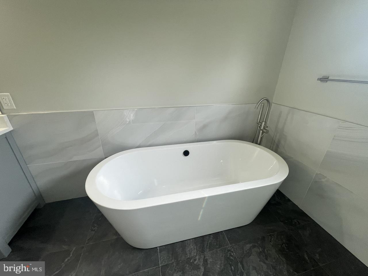 8618 Jones Mill Road Chevy Chase, MD 20815 - Photo 44 of 59 a white tub sitting in a bathroom