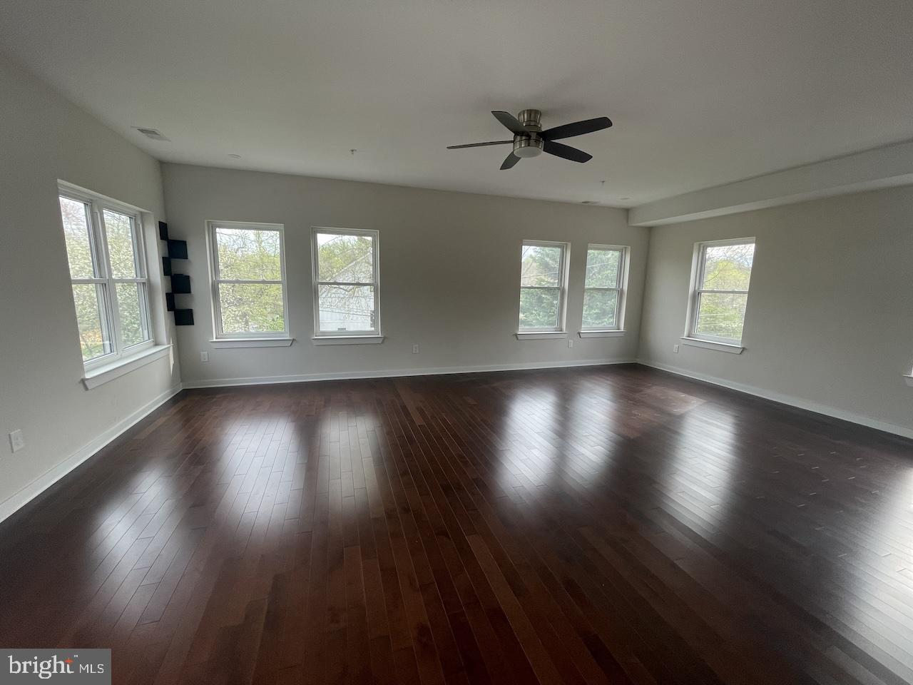 8618 Jones Mill Road Chevy Chase, MD 20815 - Photo 50 of 59 a view of an empty room with wooden floor and a window