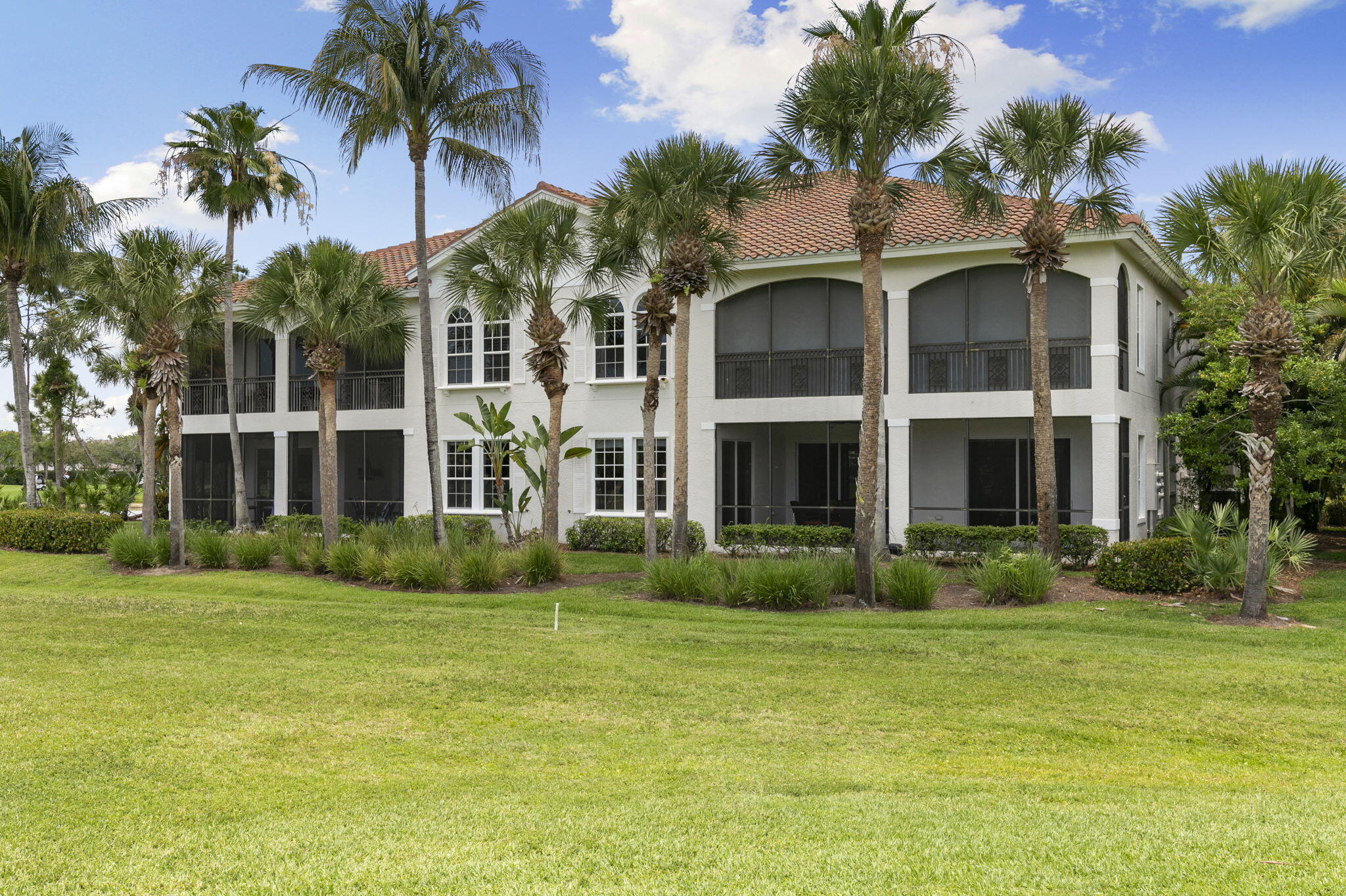 9066 Cascada Way, Unit 101 Naples, FL 34114 - Photo 29 of 51 a front view of a house with a yard