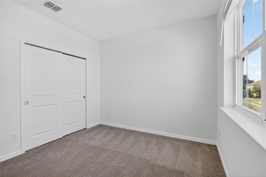 810 MIDDLETON Street DeBary, FL 32713 - Photo 40 of 52 an empty room with windows and closet