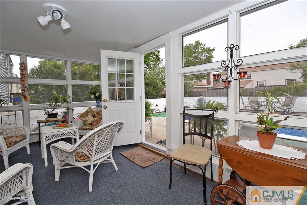 193 McFarlane Road Colonia, NJ 07067 - Photo 14 of 25 a dining room with furniture water view and a floor to ceiling window