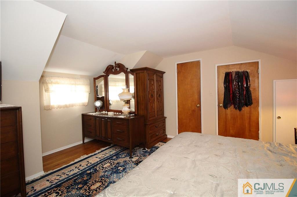193 McFarlane Road Colonia, NJ 07067 - Photo 21 of 25 a bedroom with a bed and a dresser