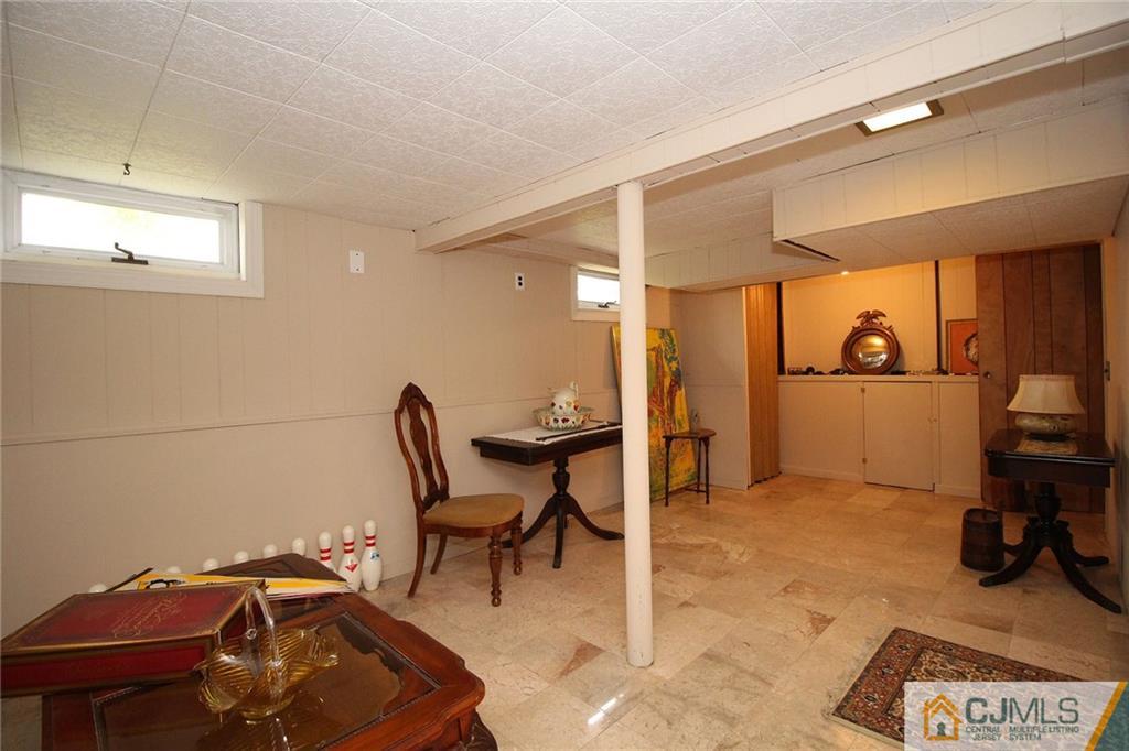 193 McFarlane Road Colonia, NJ 07067 - Photo 25 of 25 a view of a workspace with furniture and gym equipment