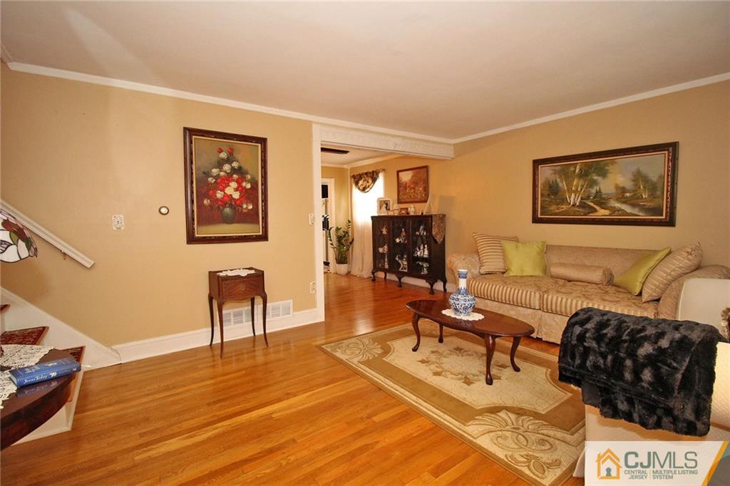 193 McFarlane Road Colonia, NJ 07067 - Photo 5 of 25 a view of a livingroom with furniture and workspace