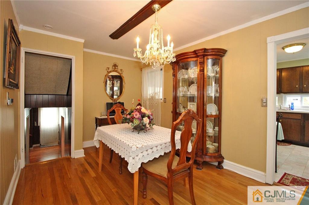 193 McFarlane Road Colonia, NJ 07067 - Photo 9 of 25 a view of a dining room with furniture and chandelier