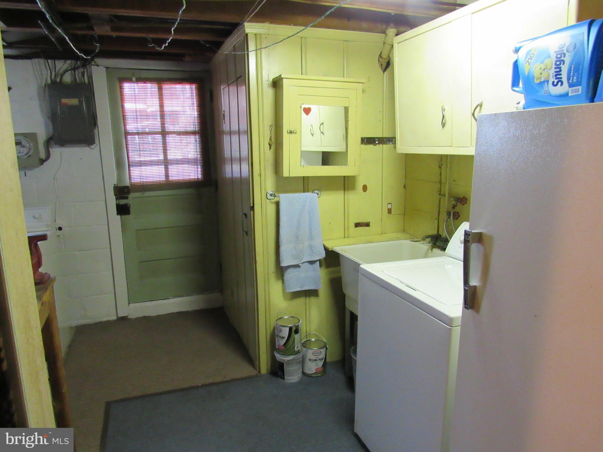 1912 Haselmere Road Baltimore, MD 21222 - Photo 22 of 29 a bathroom with a sink and mirror