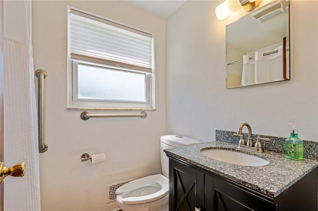 5000 Homeville Road West Mifflin, PA 15122 - Photo 12 of 24 a bathroom with a granite countertop sink and a toilet