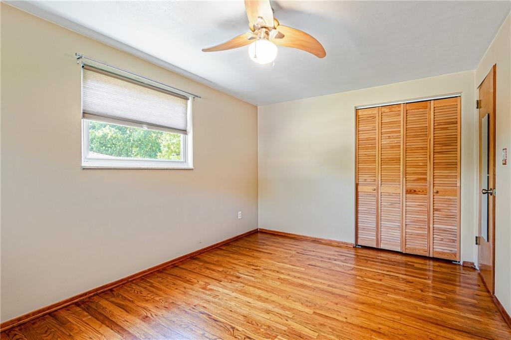 5000 Homeville Road West Mifflin, PA 15122 - Photo 16 of 24 wooden floor in an empty room with a window