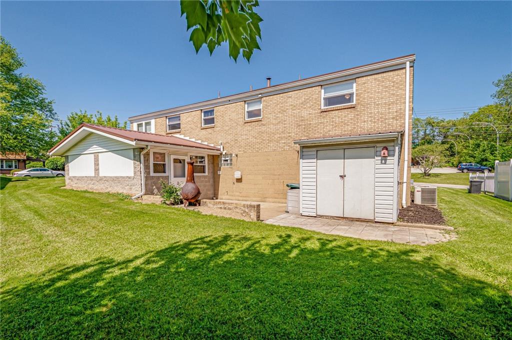 5000 Homeville Road West Mifflin, PA 15122 - Photo 23 of 24 a front view of a house with a yard and garage