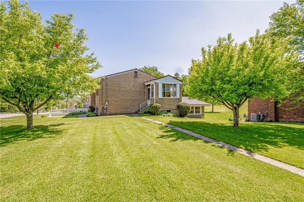 5000 Homeville Road West Mifflin, PA 15122 - Photo 24 of 24 a front view of a house with a yard and trees