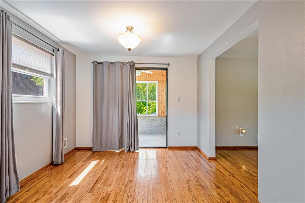 5000 Homeville Road West Mifflin, PA 15122 - Photo 8 of 24 an empty room with wooden floor and windows