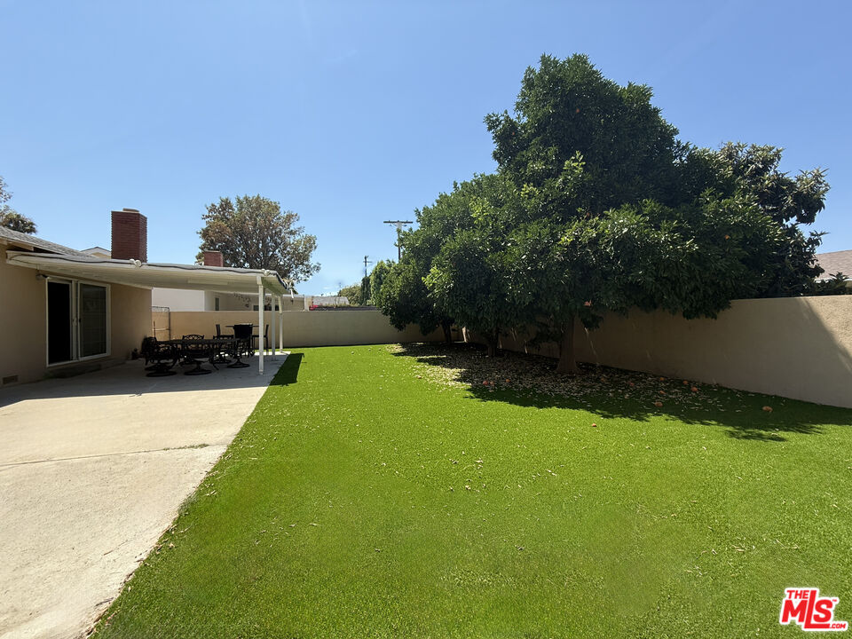 19023 Cantlay Street Reseda, CA 91335 - Photo 15 of 17 a front view of house with yard and green space