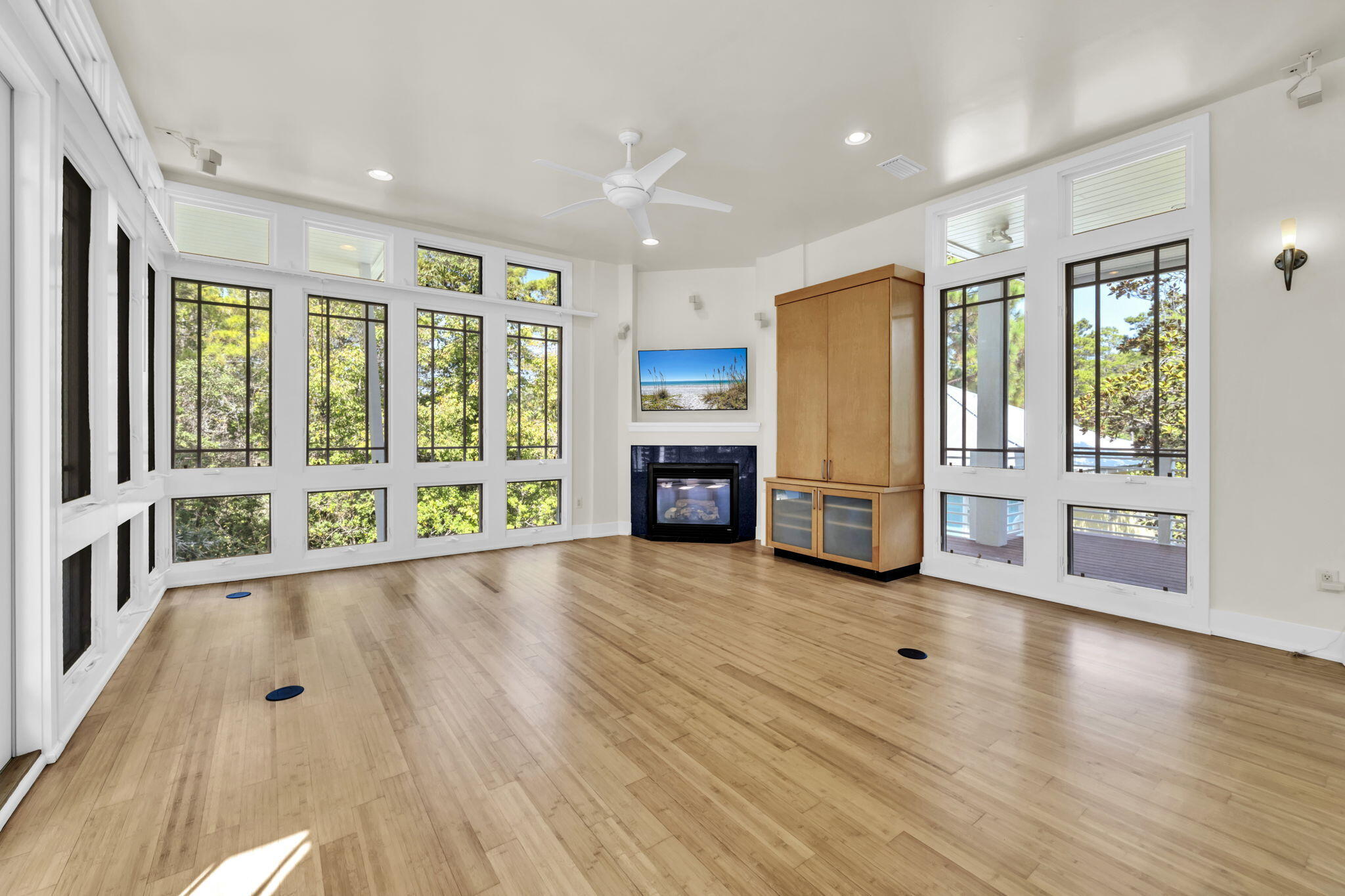 286 Forest Street Santa Rosa Beach, FL 32459 - Photo 13 of 68 a view of an empty room with wooden floor and a window