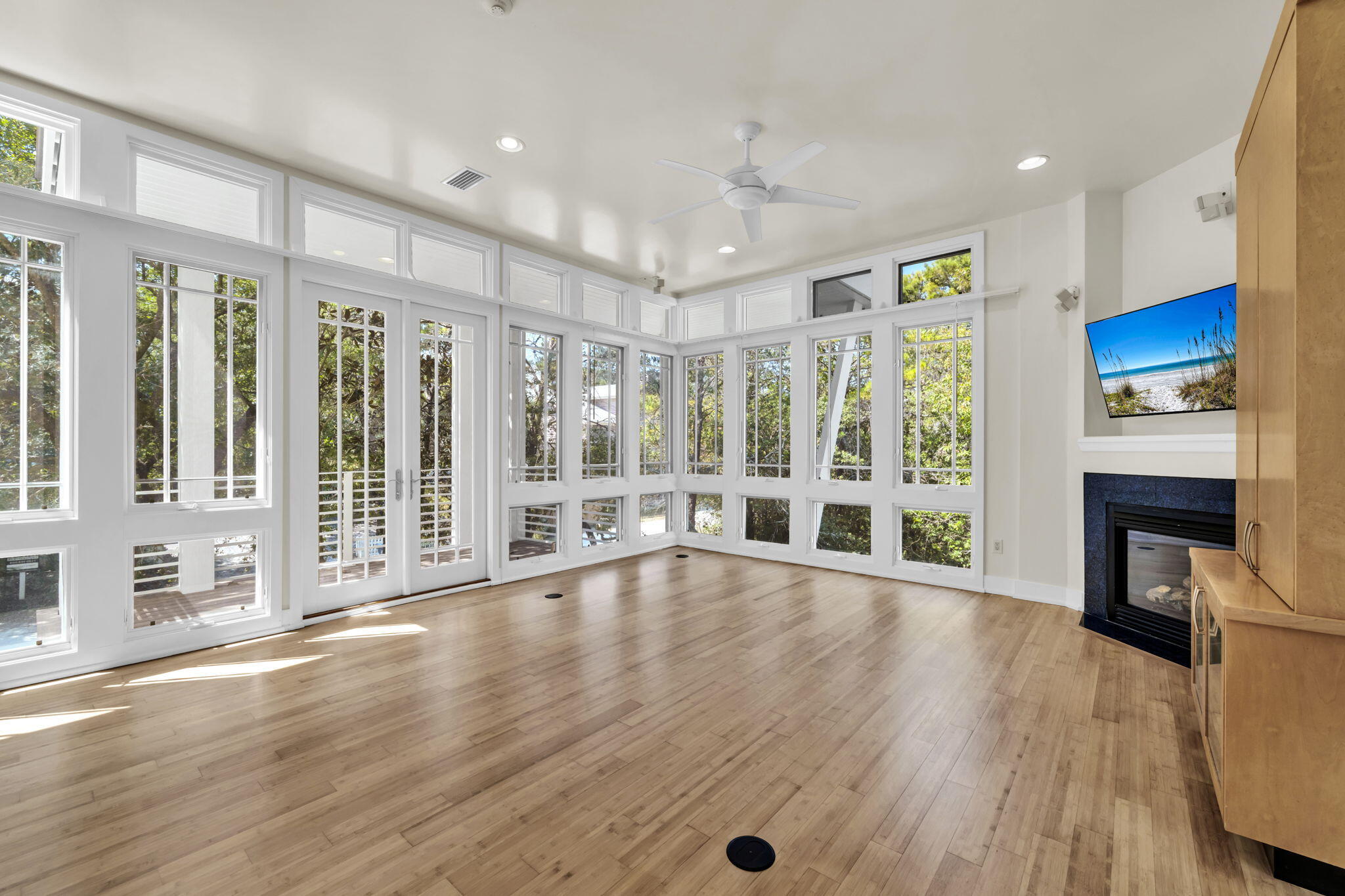 286 Forest Street Santa Rosa Beach, FL 32459 - Photo 14 of 68 a view of an empty room with wooden floor and a fireplace