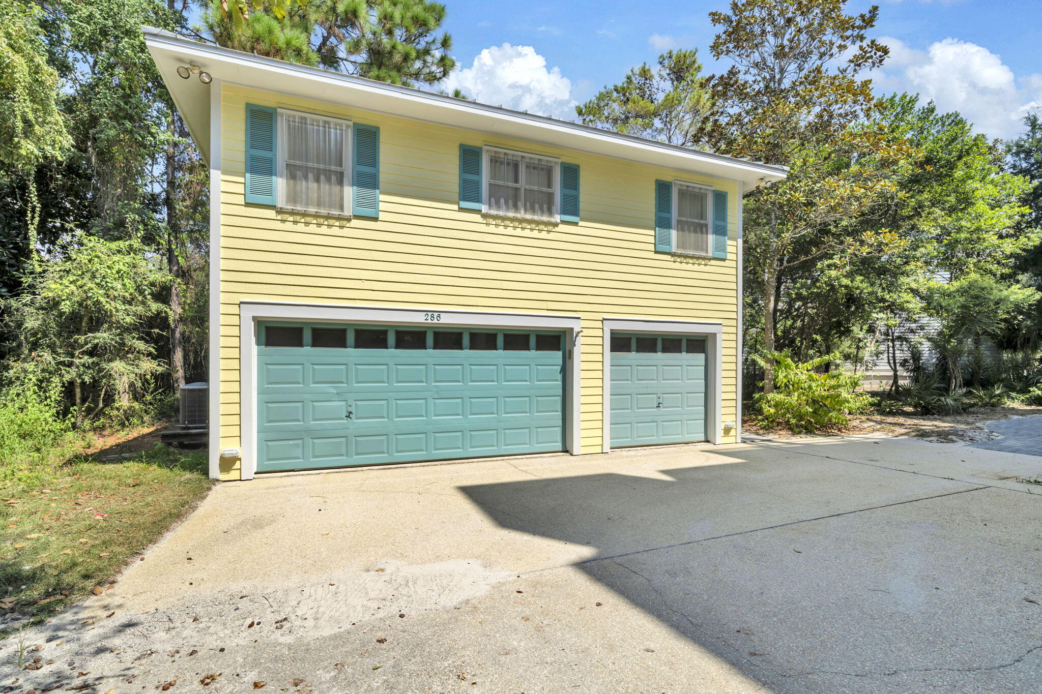 286 Forest Street Santa Rosa Beach, FL 32459 - Photo 49 of 68 a front view of a house with a garage