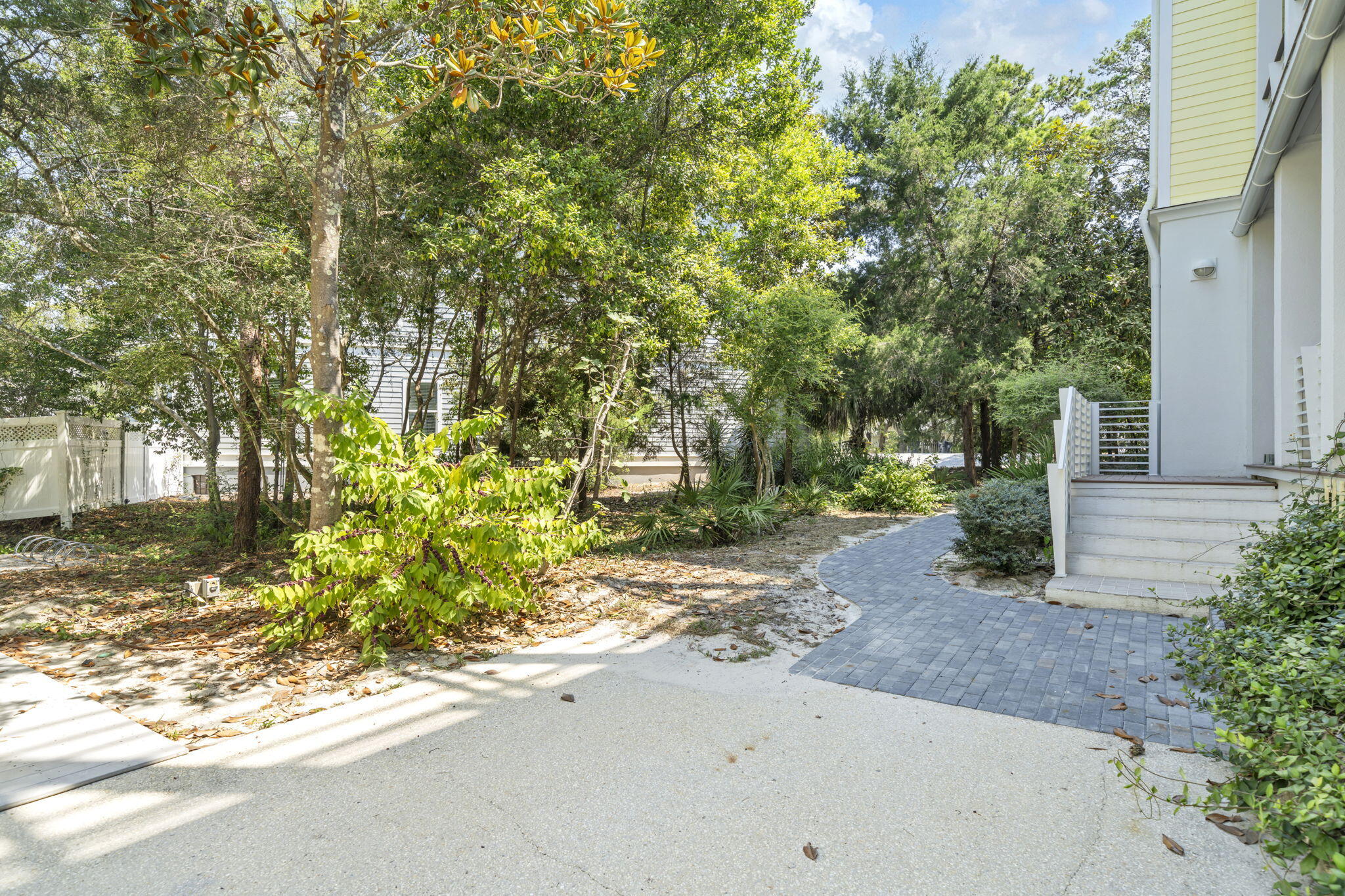 286 Forest Street Santa Rosa Beach, FL 32459 - Photo 53 of 68 a backyard of a house with large trees and plants