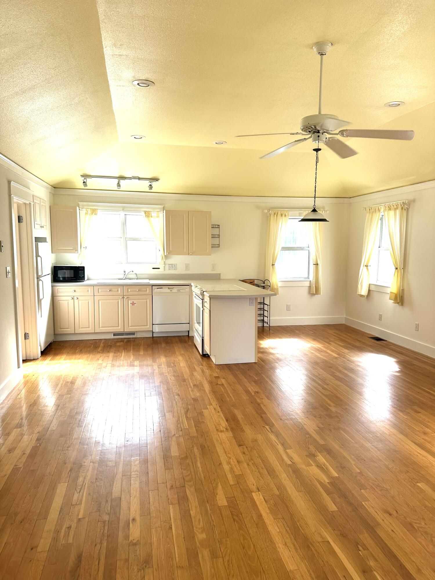 286 Forest Street Santa Rosa Beach, FL 32459 - Photo 56 of 68 a view of a kitchen with a wooden floor and a window