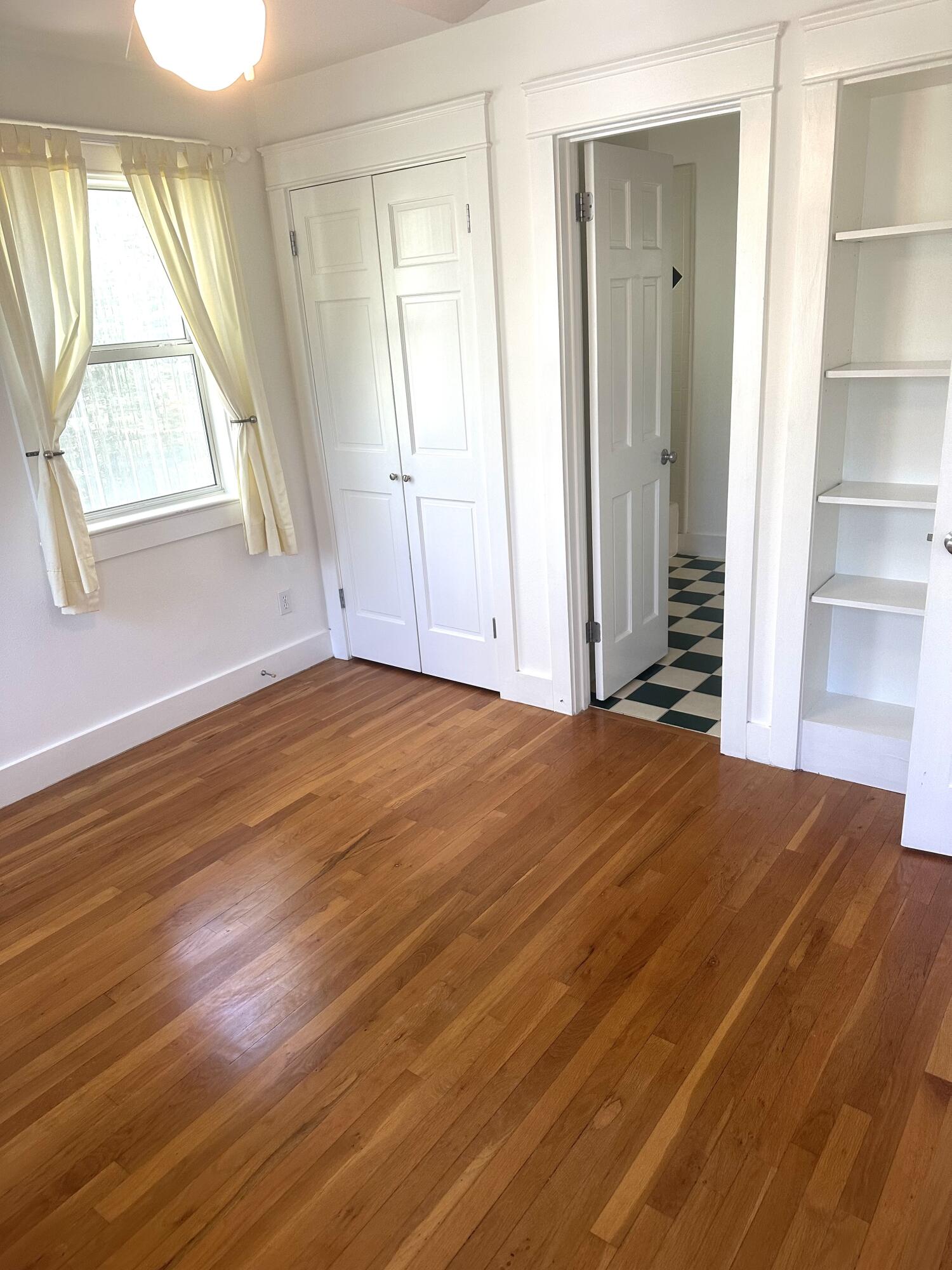 286 Forest Street Santa Rosa Beach, FL 32459 - Photo 59 of 68 a view of empty room with wooden floor and fan