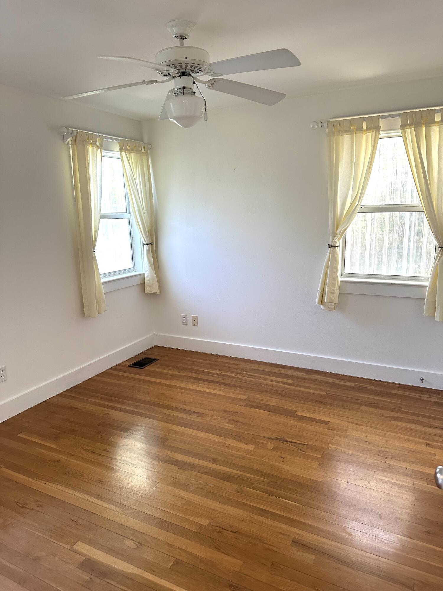 286 Forest Street Santa Rosa Beach, FL 32459 - Photo 60 of 68 a view of empty room with wooden floor and fan