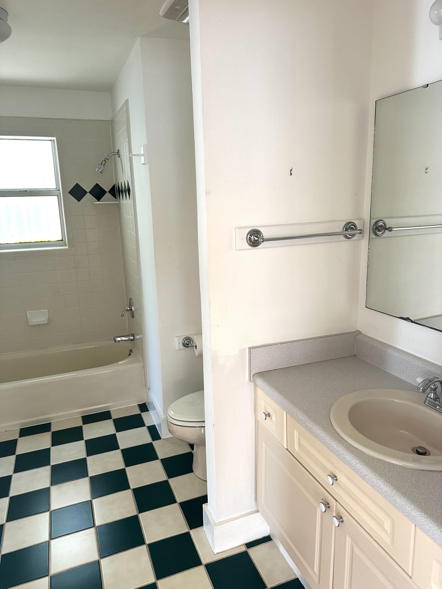 286 Forest Street Santa Rosa Beach, FL 32459 - Photo 62 of 68 a bathroom with a granite countertop sink and mirror with toilet