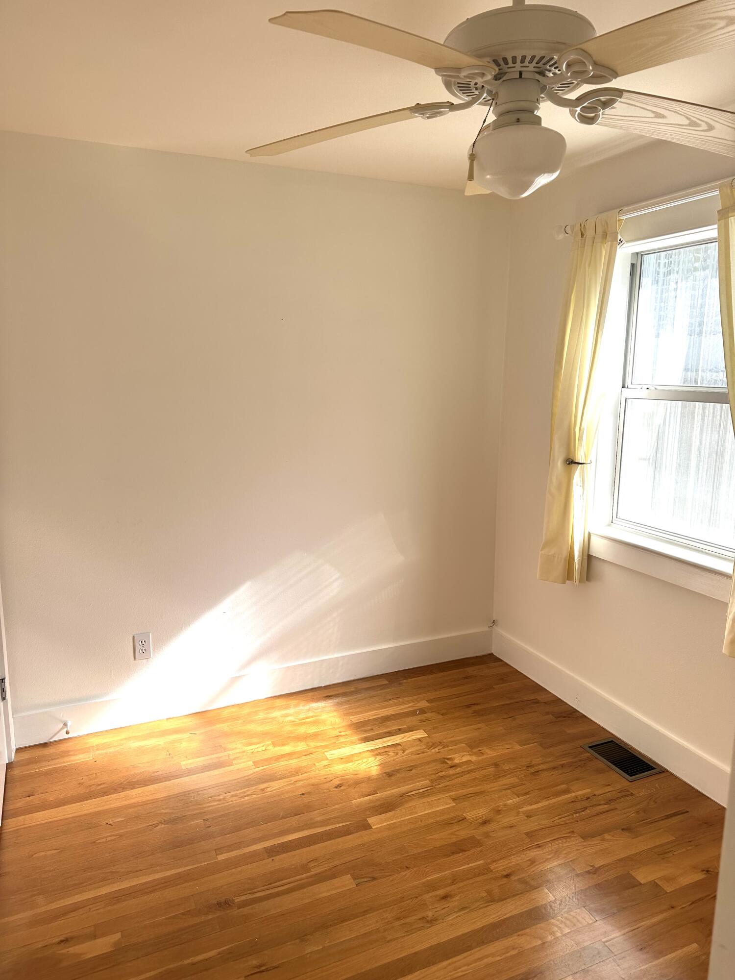 286 Forest Street Santa Rosa Beach, FL 32459 - Photo 63 of 68 a view of empty room with window and wooden floor