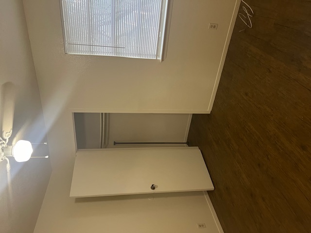 501 Hedgewood Drive, Unit D Georgetown, TX 78628 - Photo 13 of 15 Unfurnished bedroom with dark wood-type flooring, a closet, and a ceiling fan