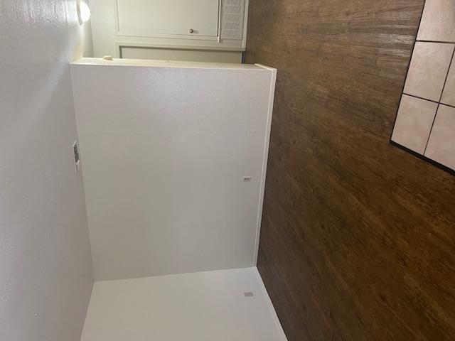 501 Hedgewood Drive, Unit D Georgetown, TX 78628 - Photo 3 of 15 Unfurnished room with dark wood-style flooring and baseboards