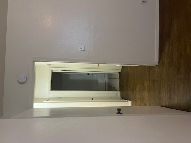 501 Hedgewood Drive, Unit D Georgetown, TX 78628 - Photo 10 of 15 Hallway featuring baseboards and dark wood-style flooring