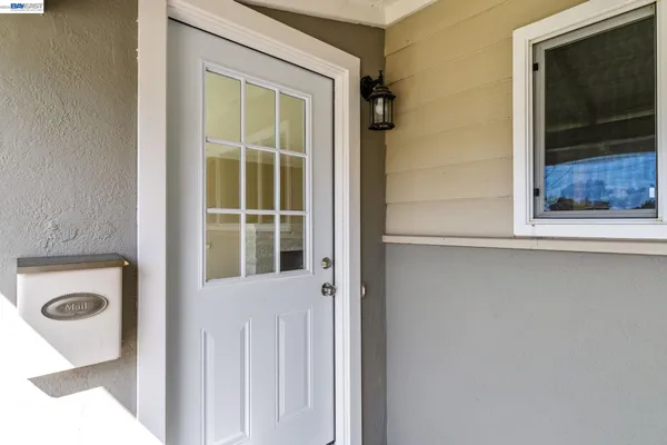 a view of a door and a window