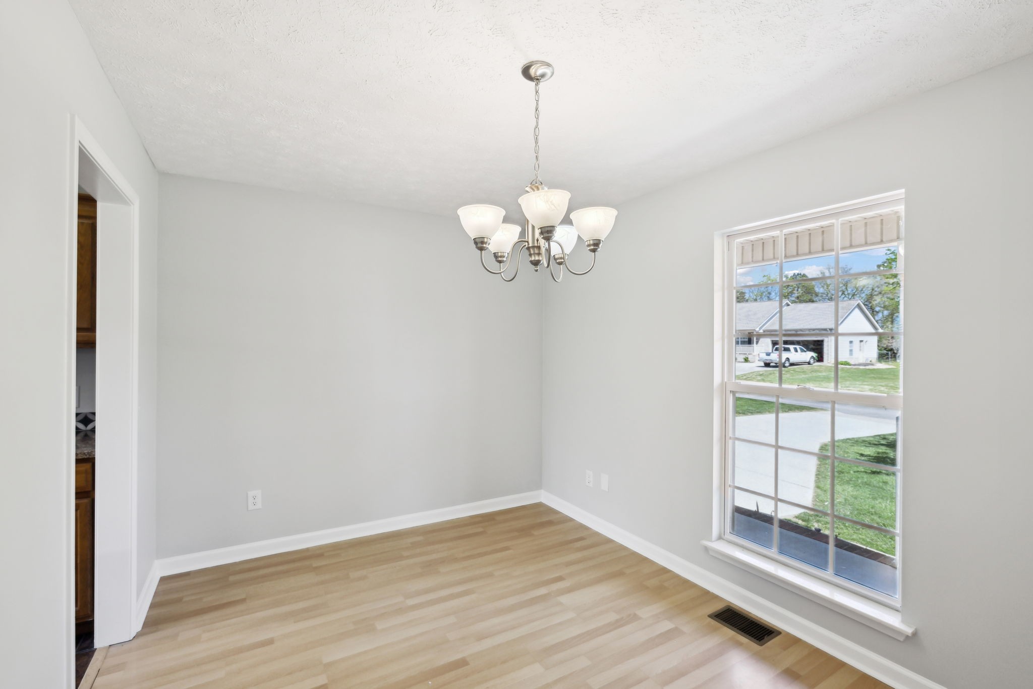 623 Audrey Road Mount Juliet, TN 37122 - Photo 11 of 27 a view of a room with wooden floor and chandelier