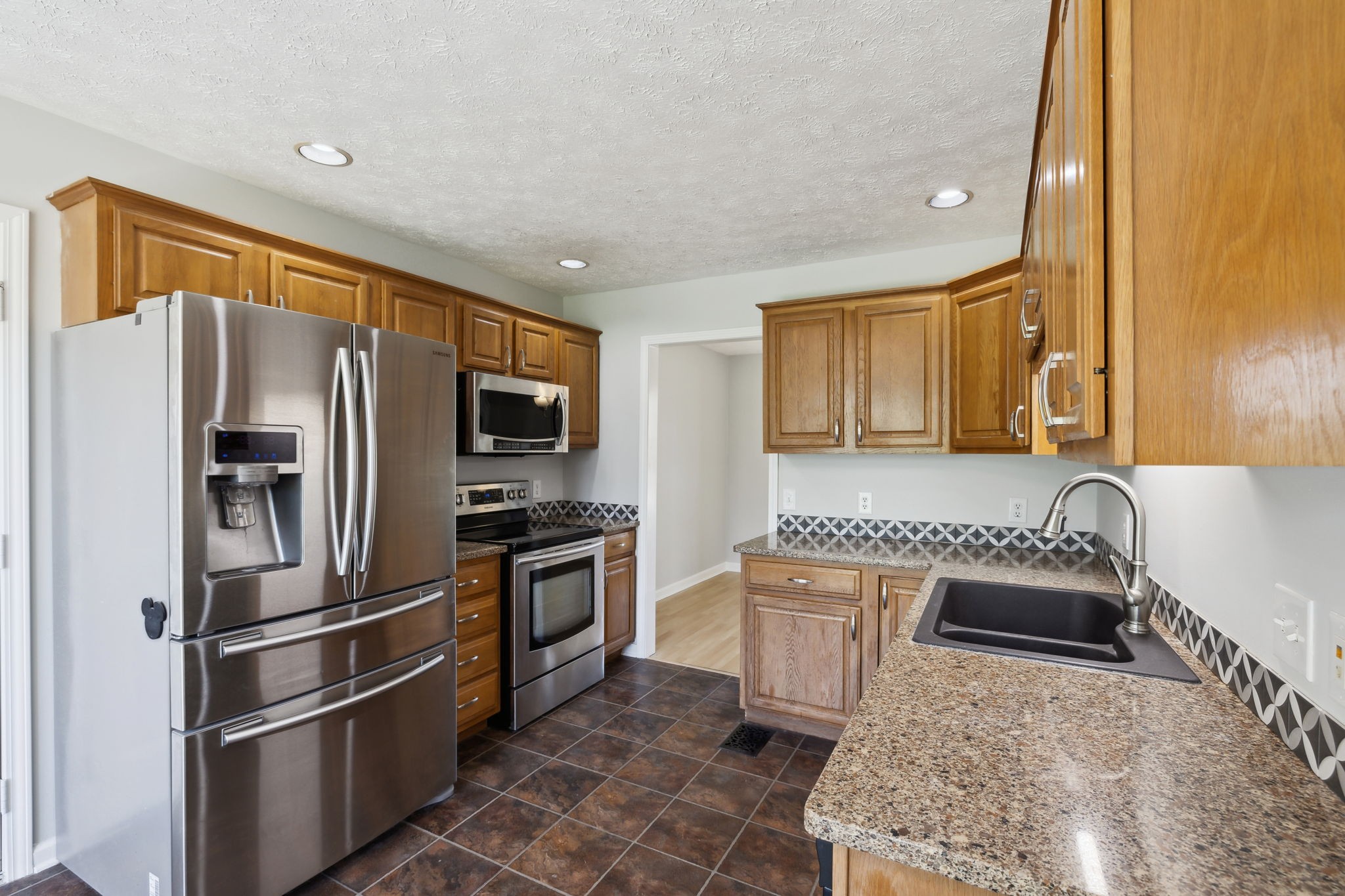 623 Audrey Road Mount Juliet, TN 37122 - Photo 8 of 27 a kitchen with stainless steel appliances granite countertop a refrigerator stove and sink