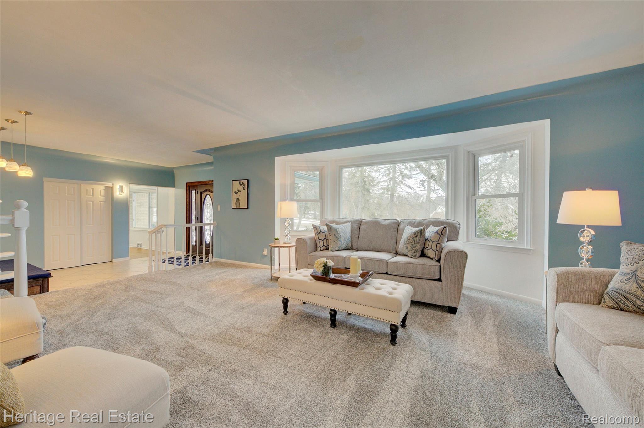 654 Old Perch Road Rochester, MI 48309 - Photo 8 of 61 Living room is very spacious and features a large bay window, brand new carpet and a cove ceiling.