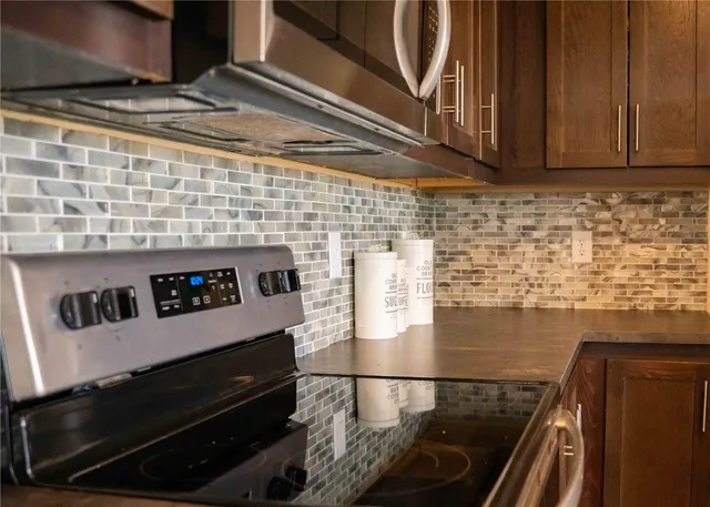 a bedroom with a bed and flat screen tv