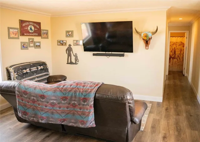 a kitchen with kitchen island a stove a refrigerator and a sink