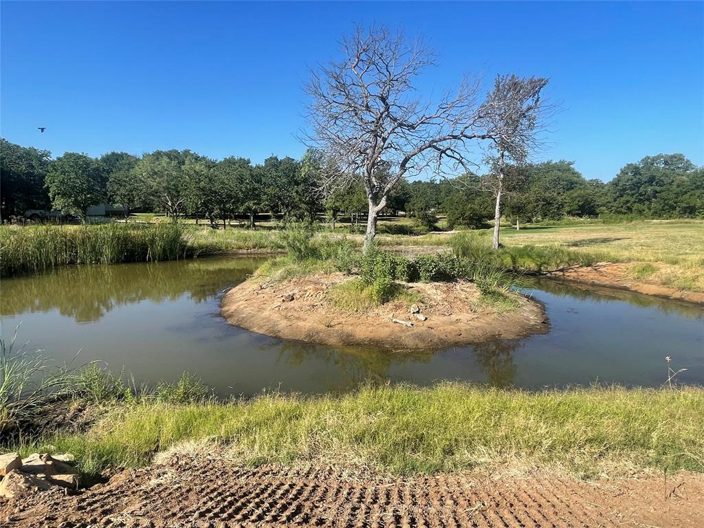 Tbd Lower Tonk Valley Road Graham, TX 76450 - Photo 7 of 15 a view of a lake with a yard