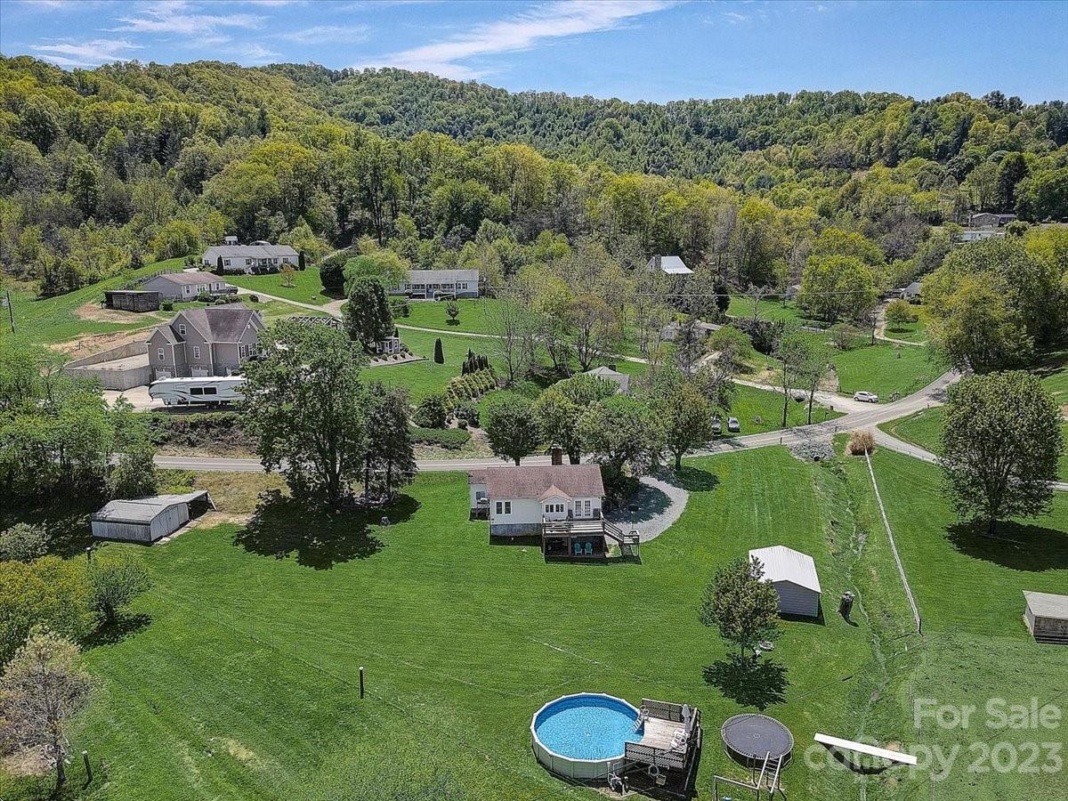 1393 Queentown Road Canton, NC 28716 - Photo 39 of 42 an aerial view of a house with a yard