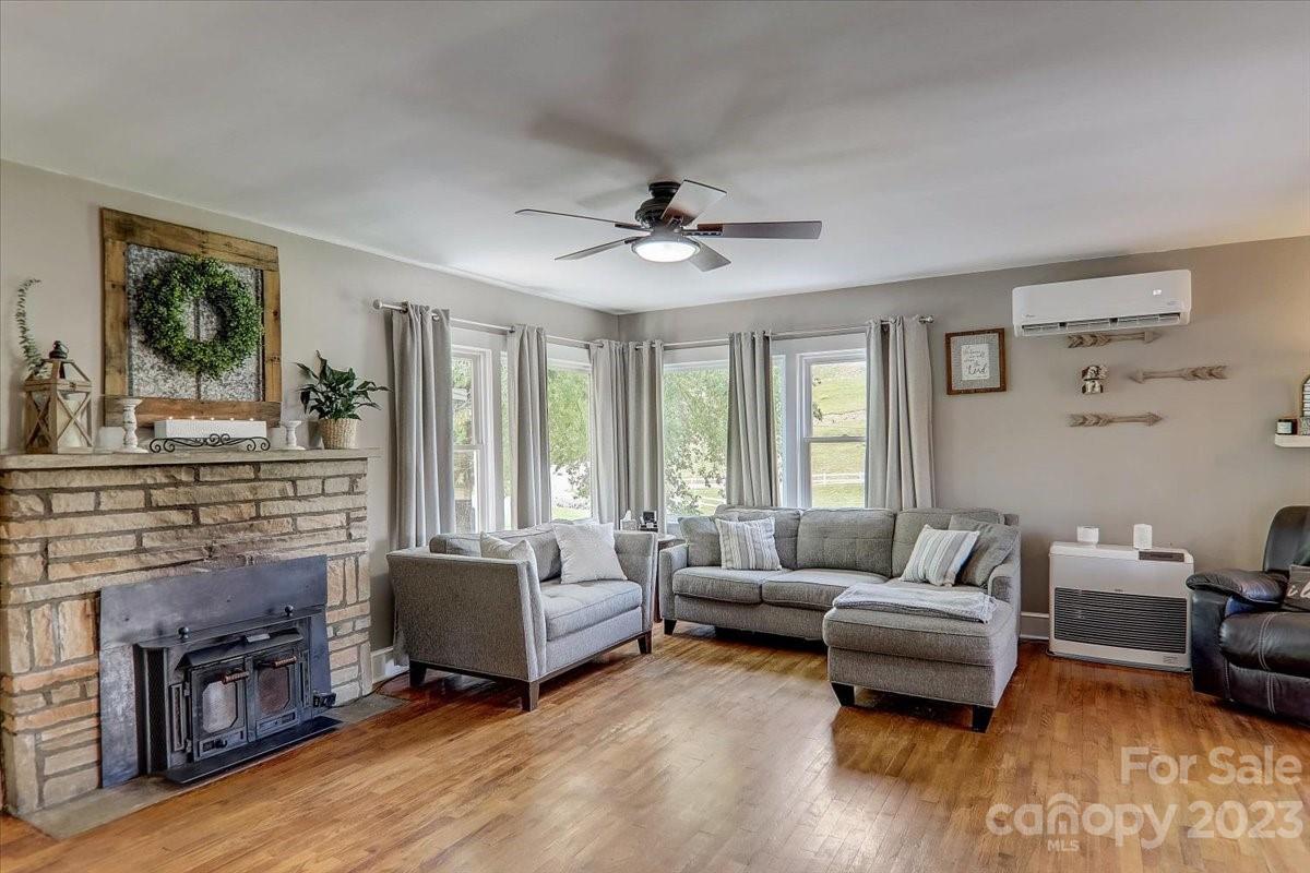 1393 Queentown Road Canton, NC 28716 - Photo 8 of 42 a living room with furniture and a fireplace