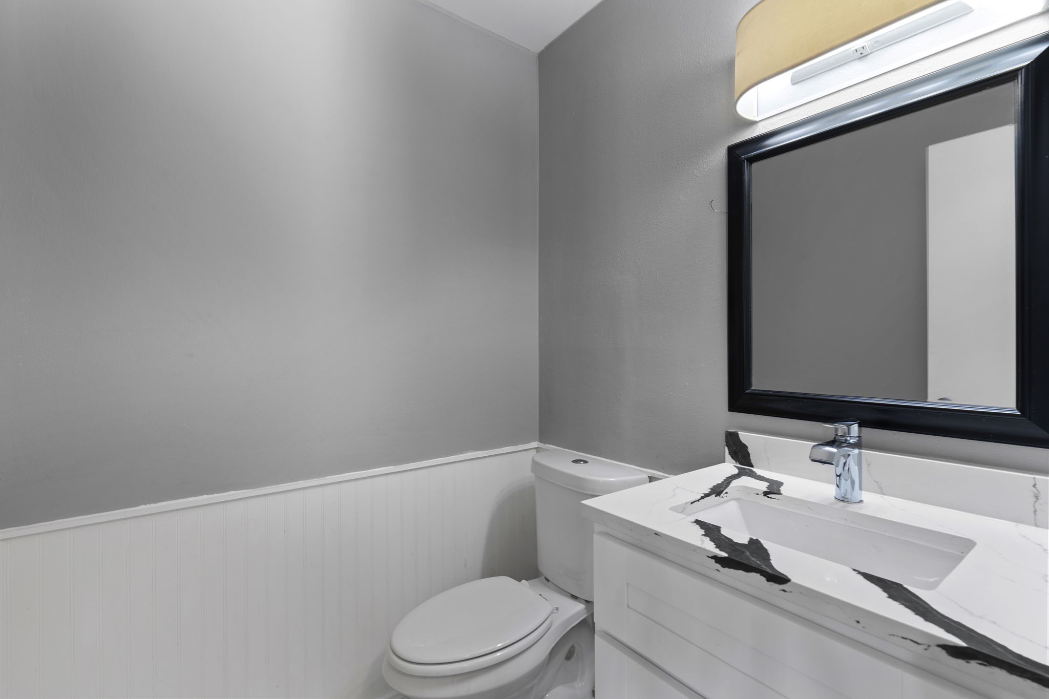 5801 Lumberdale Road, Unit 127 Houston, TX 77092 - Photo 15 of 26 a bathroom with a granite countertop sink vanity mirror and toilet