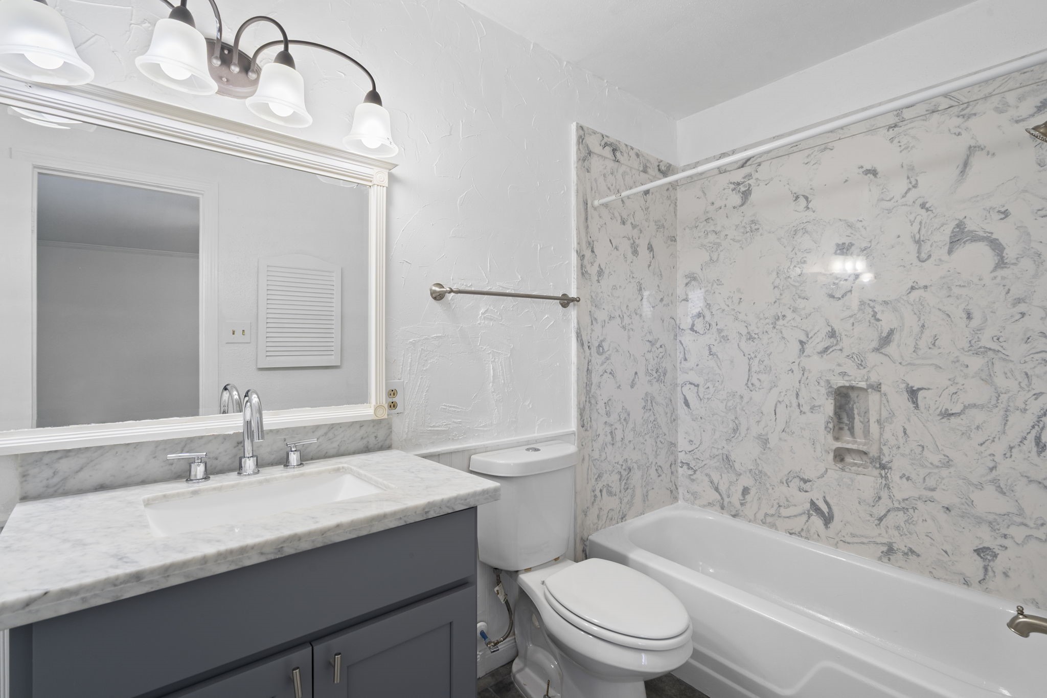 5801 Lumberdale Road, Unit 127 Houston, TX 77092 - Photo 16 of 26 a bathroom with a granite countertop sink a toilet and shower