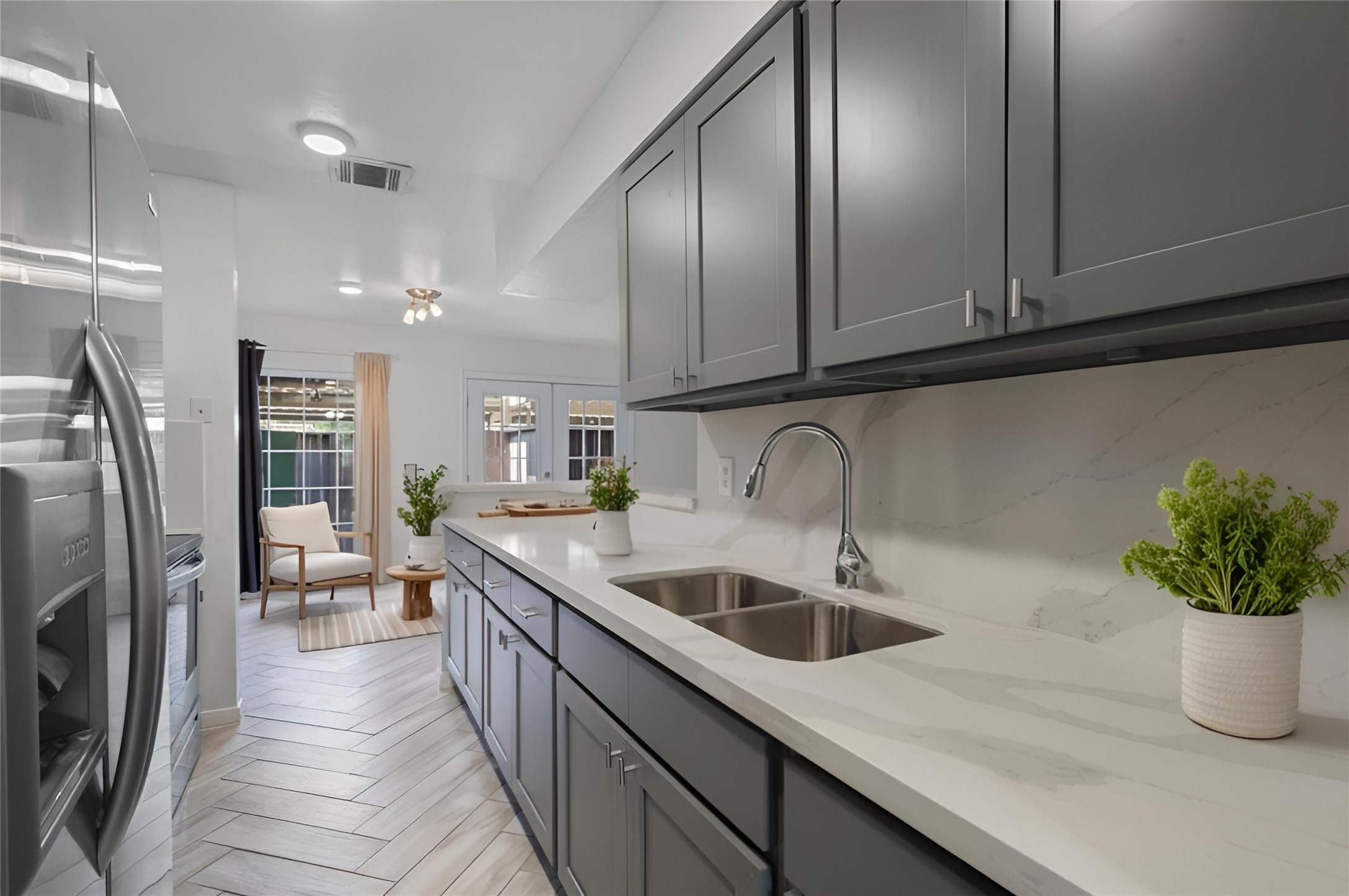 5801 Lumberdale Road, Unit 127 Houston, TX 77092 - Photo 2 of 26 a kitchen with stainless steel appliances granite countertop a sink a refrigerator and a wooden cabinets