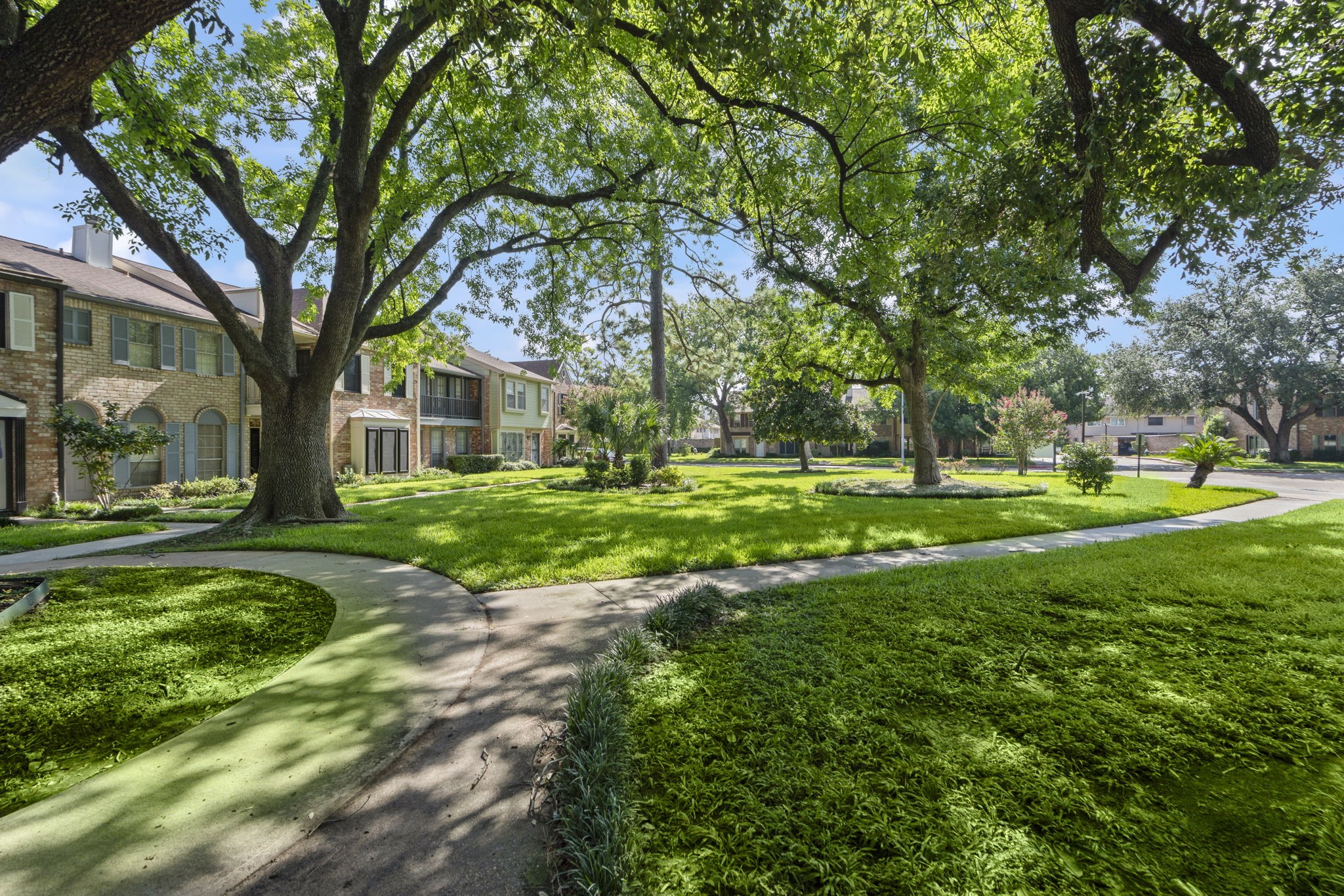 5801 Lumberdale Road, Unit 127 Houston, TX 77092 - Photo 22 of 26 a view of a house with a big yard and large trees
